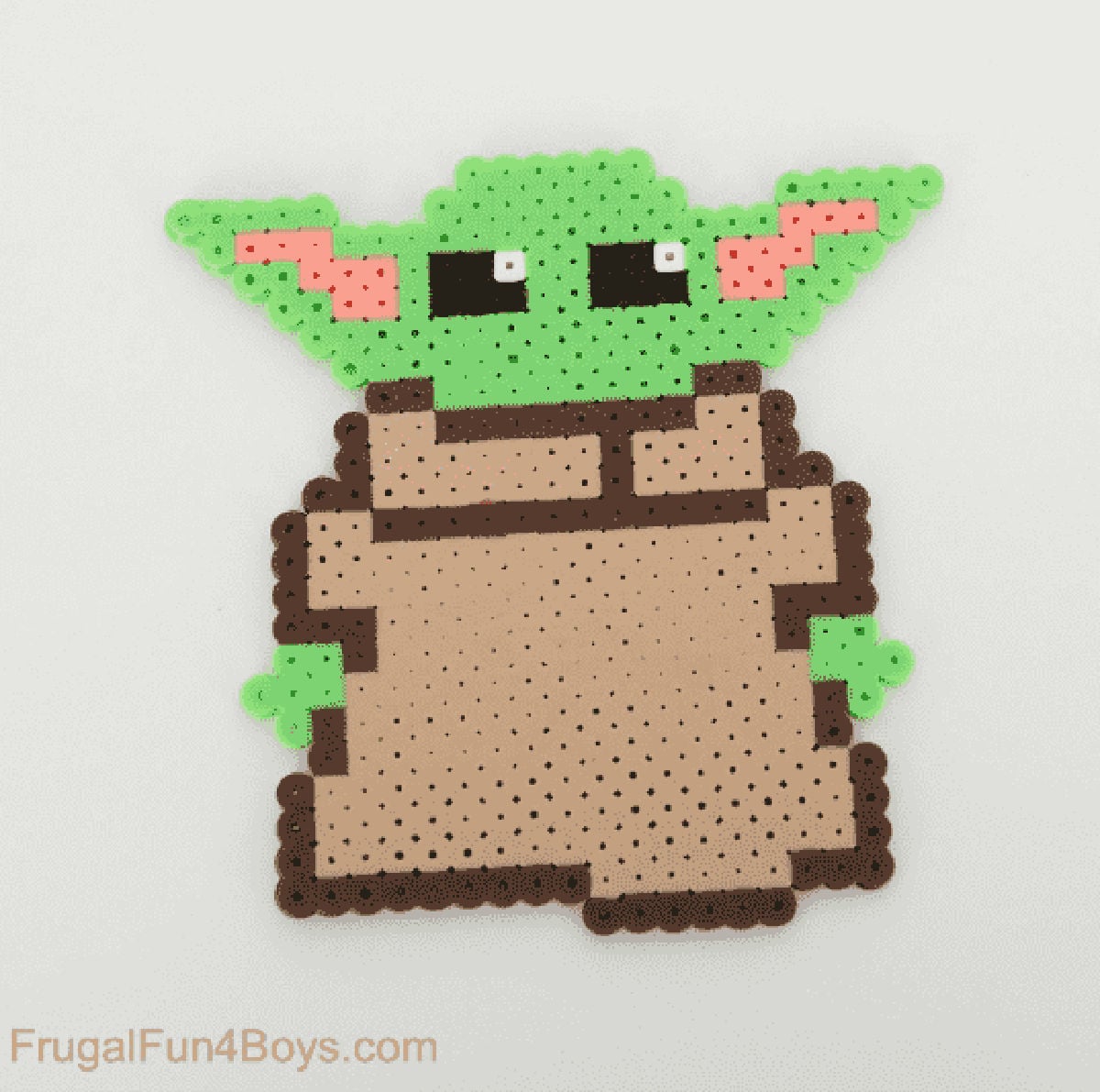 Baby Yoda made out of beads.