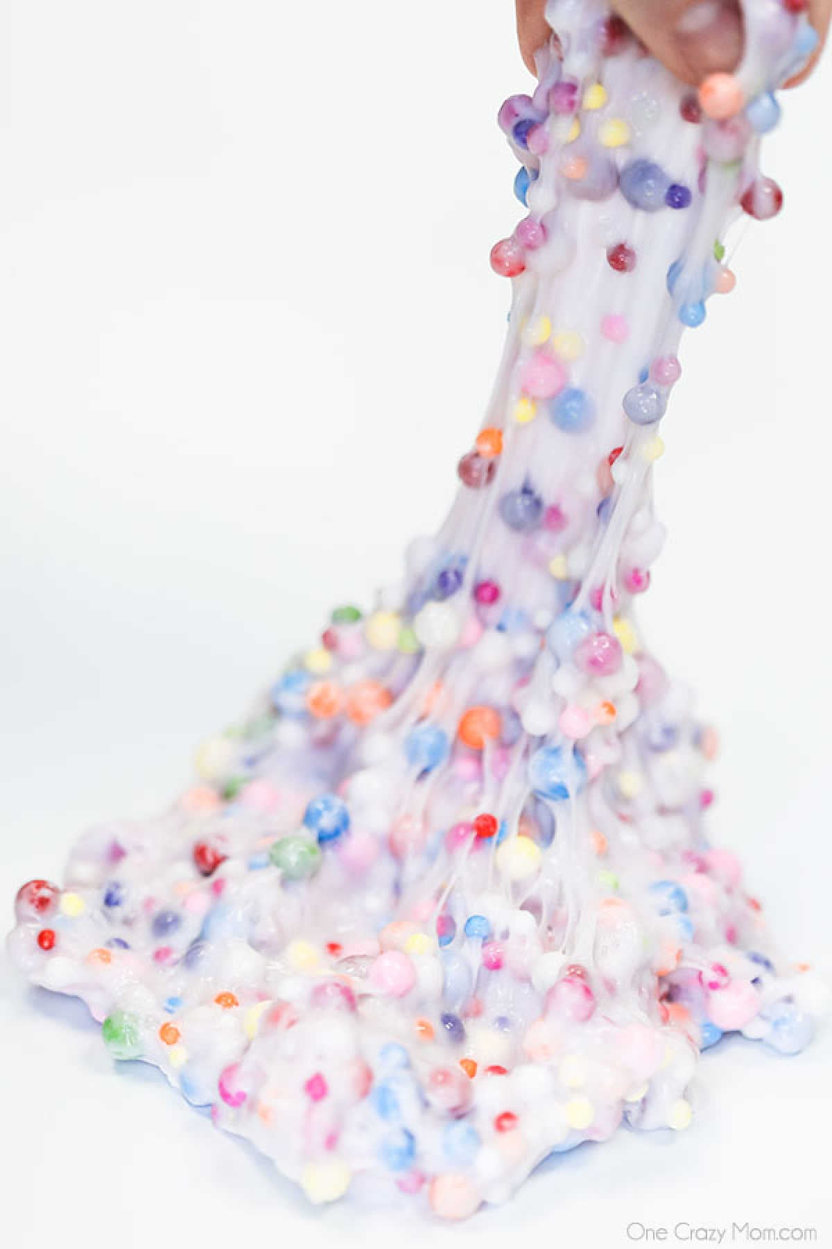 Learn how to make Birthday Cake Slime with only 3 ingredients. Adults and kids love making this birthday cake foam slime recipe in just minutes. It's easy to make this DIY slime recipe! #onecrazymom #slimerecipes #birthdaycakeslime