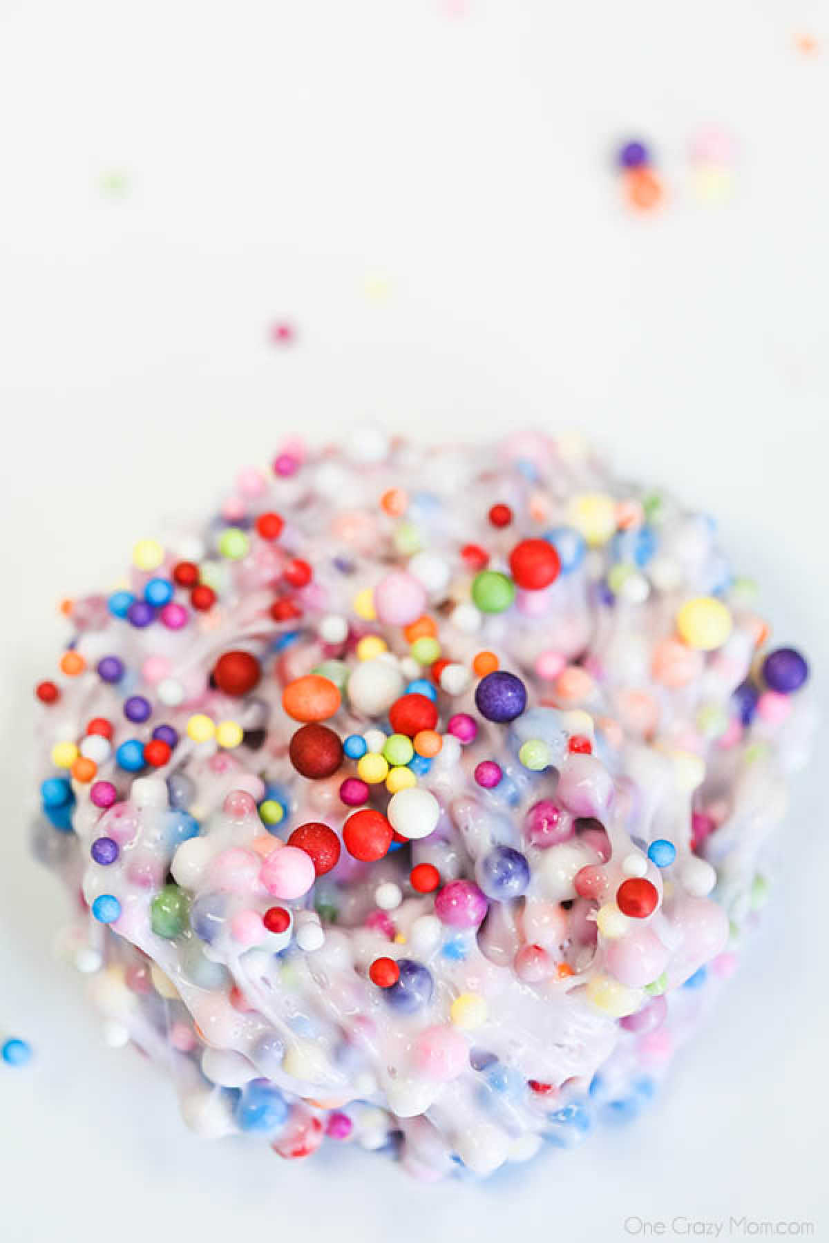 Learn how to make Birthday Cake Slime with only 3 ingredients. Adults and kids love making this birthday cake foam slime recipe in just minutes. It's easy to make this DIY slime recipe! #onecrazymom #slimerecipes #birthdaycakeslime