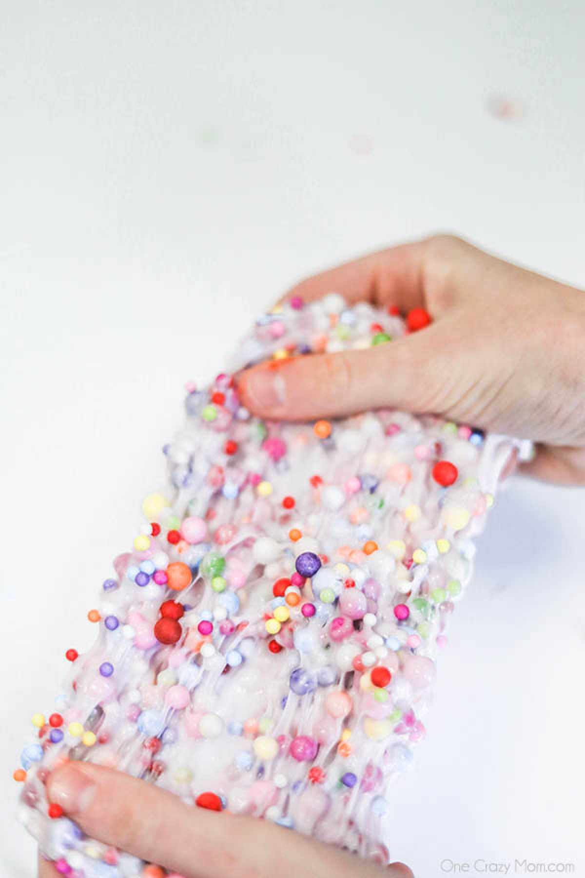 Learn how to make Birthday Cake Slime with only 3 ingredients. Adults and kids love making this birthday cake foam slime recipe in just minutes. It's easy to make this DIY slime recipe! #onecrazymom #slimerecipes #birthdaycakeslime