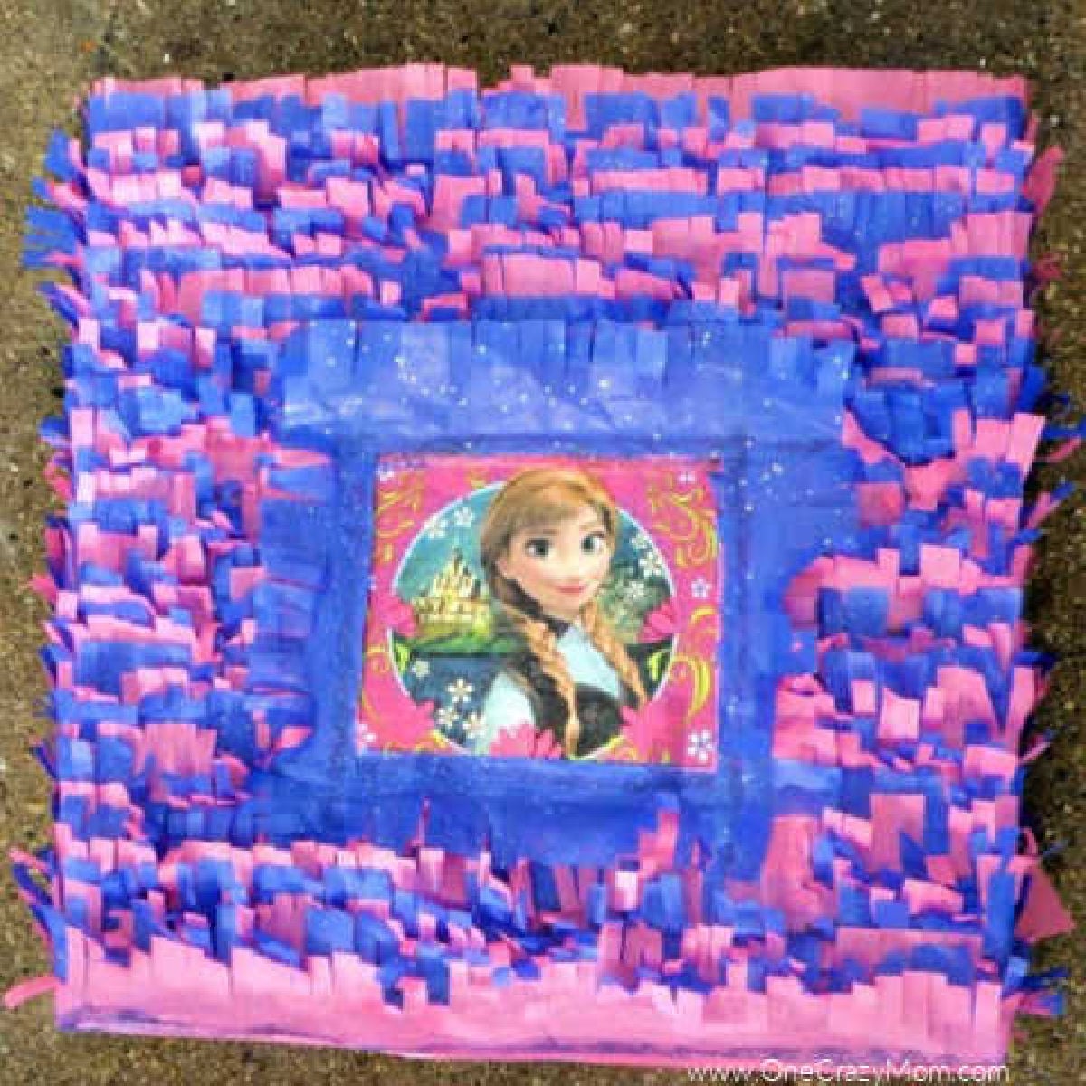 Learn how to make a pinata for under $5! Find frozen birthday party ideas that are easy and budget friendly. How to make a Frozen Birthday Party Pinata. Frozen pinata ready to use.