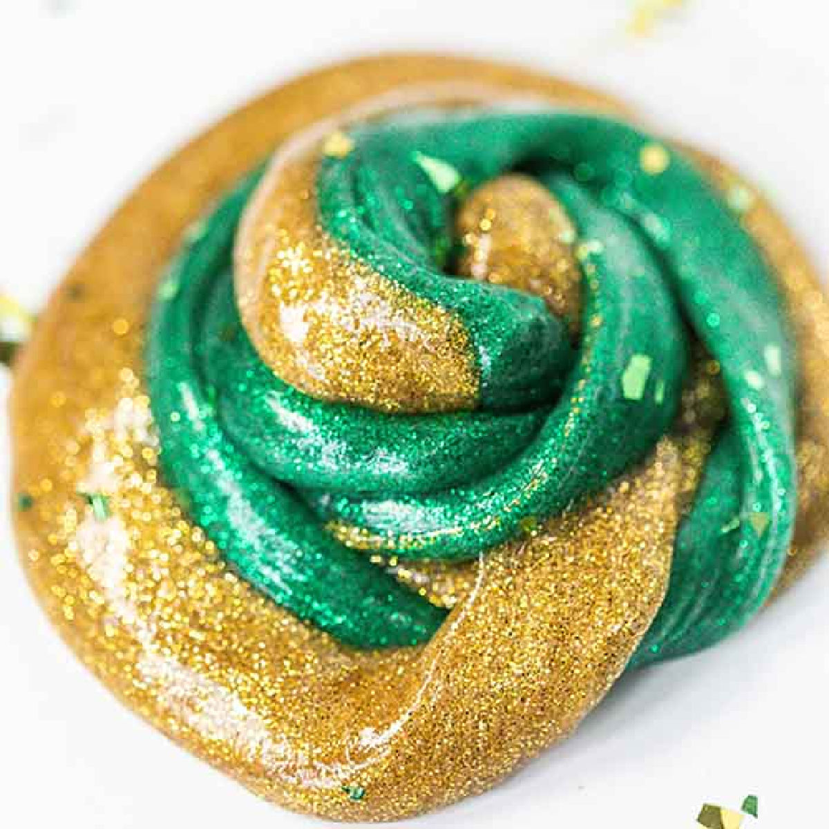 Everyone loves to make slime and your kids will go crazy over this St Patrick's Day Slime. It is so glittery and fun to make and play with. St Patrick's Day Slime swirled together.