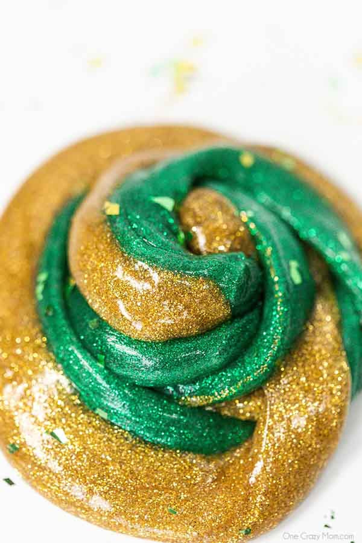Everyone loves to make slime and your kids will go crazy over this St Patrick's Day Slime. It is so glittery and fun to make and play with. St Patrick's Day Slime swirled together.