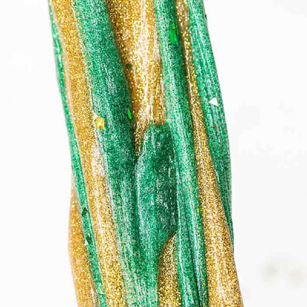 Everyone loves to make slime and your kids will go crazy over this St Patrick's Day Slime. It is so glittery and fun to make and play with. St Patrick's Day Slime stretched out.