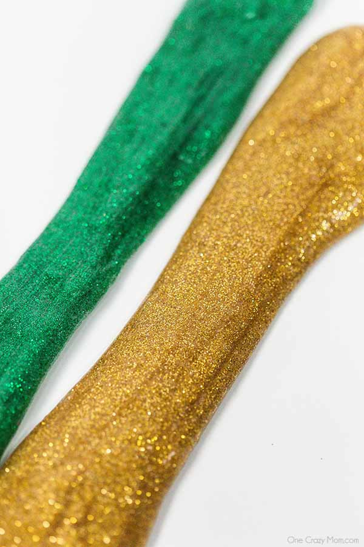 Everyone loves to make slime and your kids will go crazy over this St Patrick's Day Slime. It is so glittery and fun to make and play with. Green and Gold slime ready to swirl.