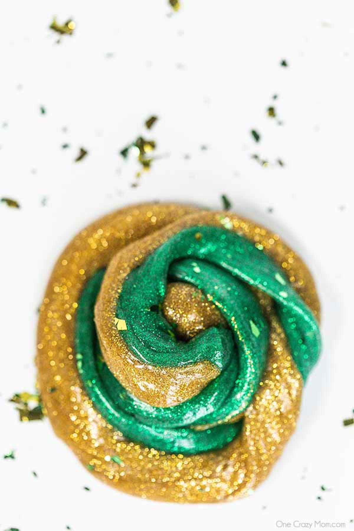 Everyone loves to make slime and your kids will go crazy over this St Patrick's Day Slime. It is so glittery and fun to make and play with. St Patrick's Day Slime swirled together.