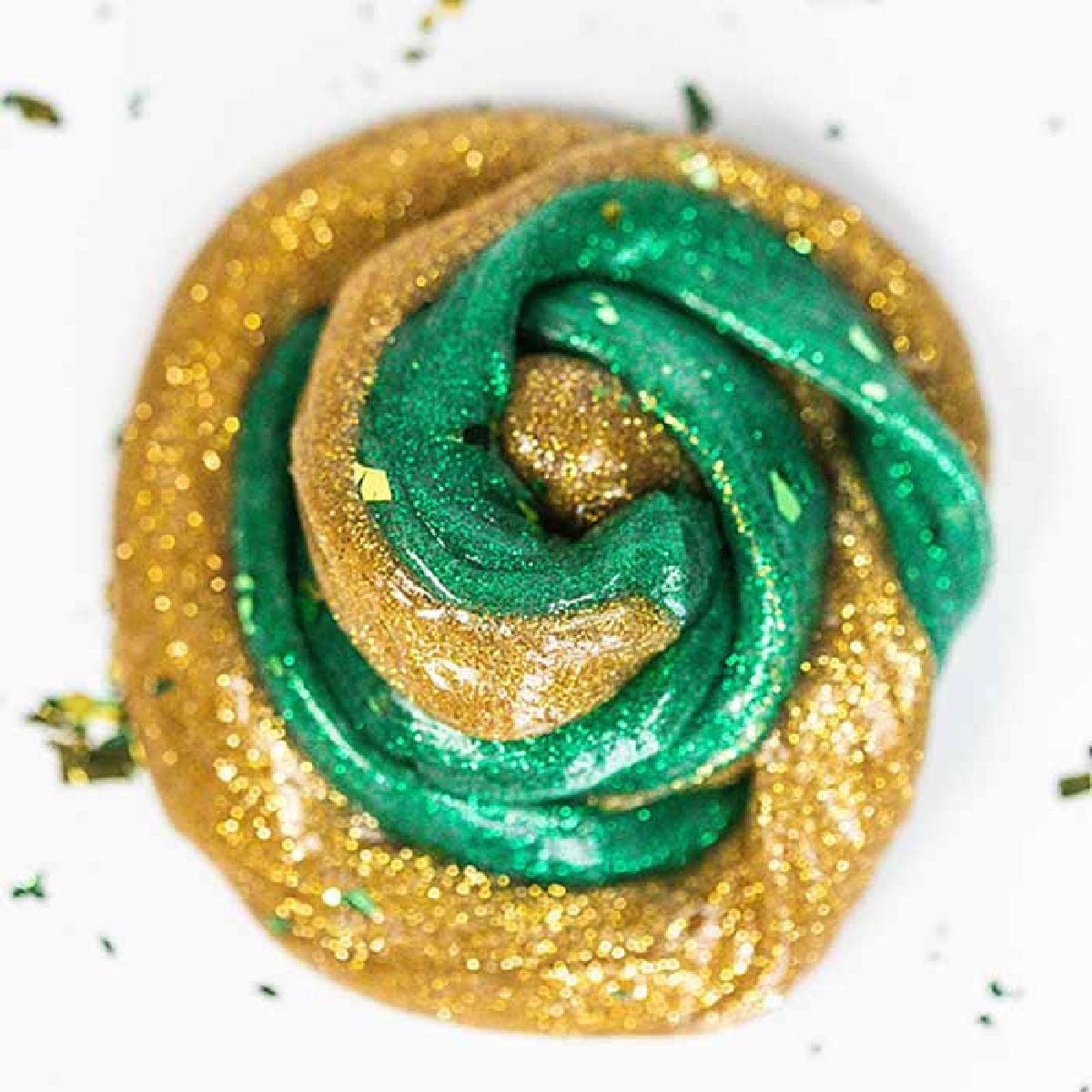 Everyone loves to make slime and your kids will go crazy over this St Patrick's Day Slime. It is so glittery and fun to make and play with. St Patrick's Day Slime swirled together.