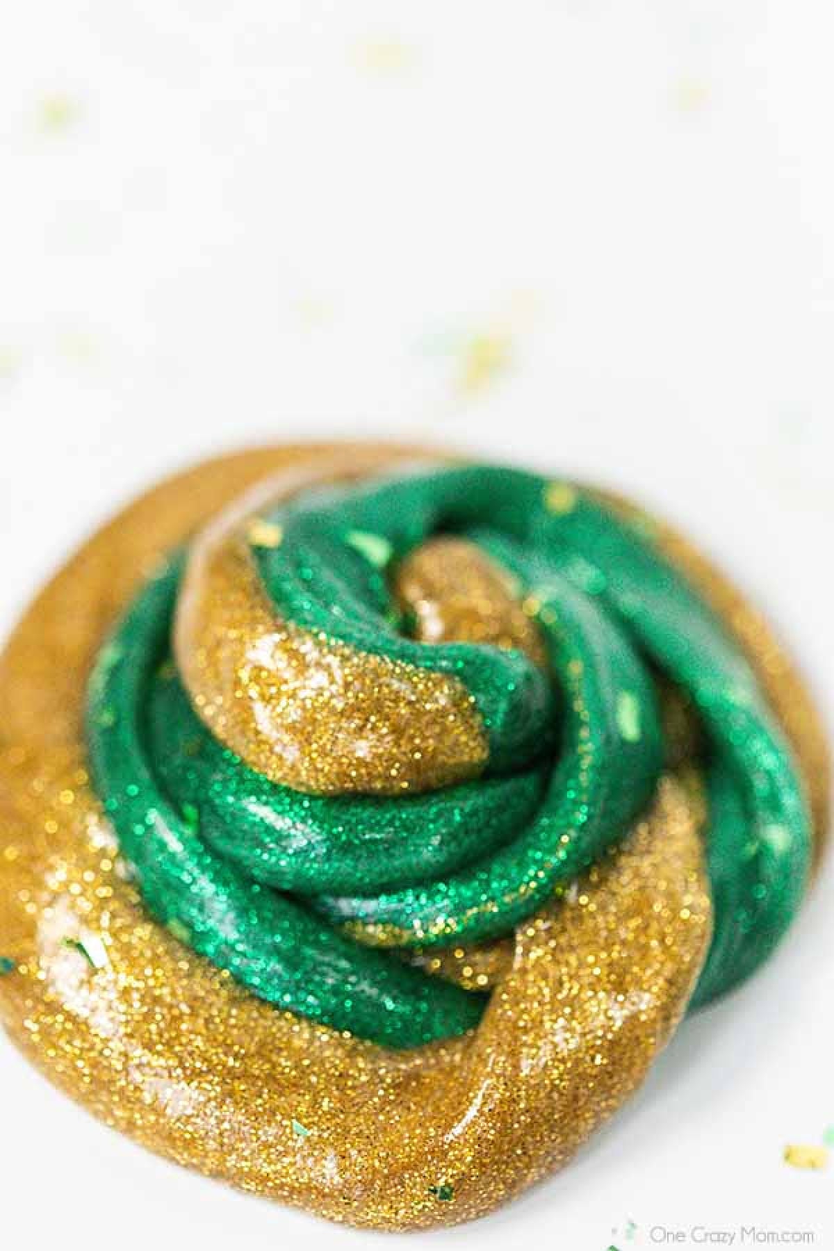 Everyone loves to make slime and your kids will go crazy over this St Patrick's Day Slime. It is so glittery and fun to make and play with. St Patrick's Day Slime swirled together.