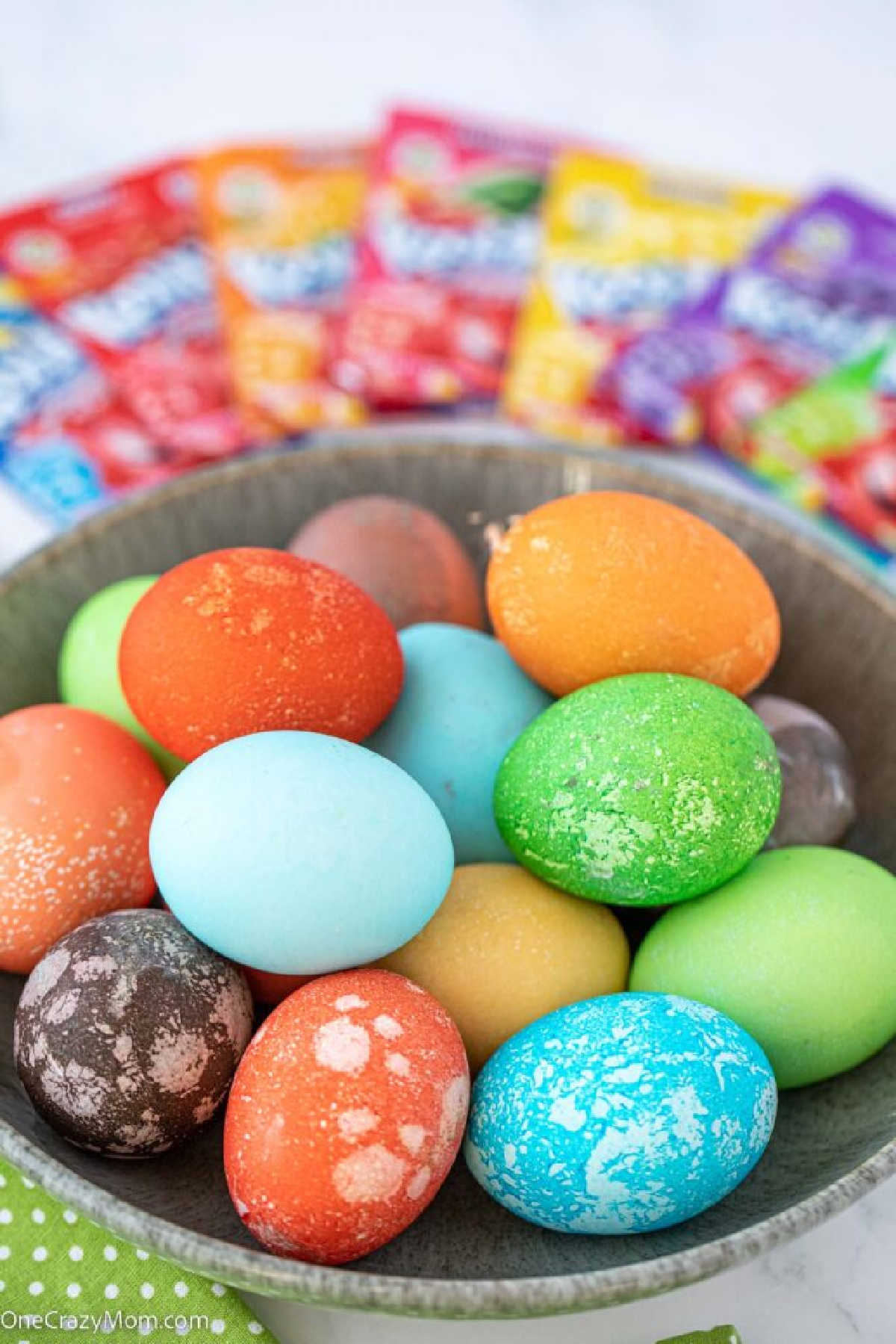 Kool Aid dyed eggs in a basket.