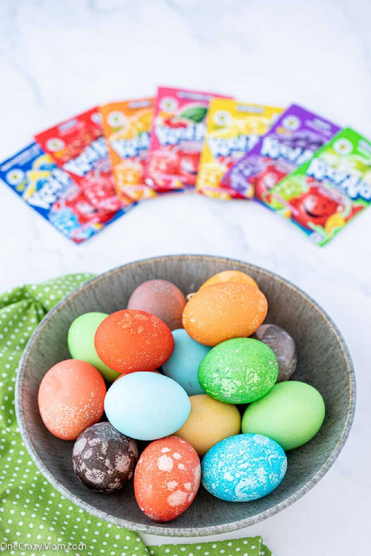 Kool Aid dyed eggs in a basket.