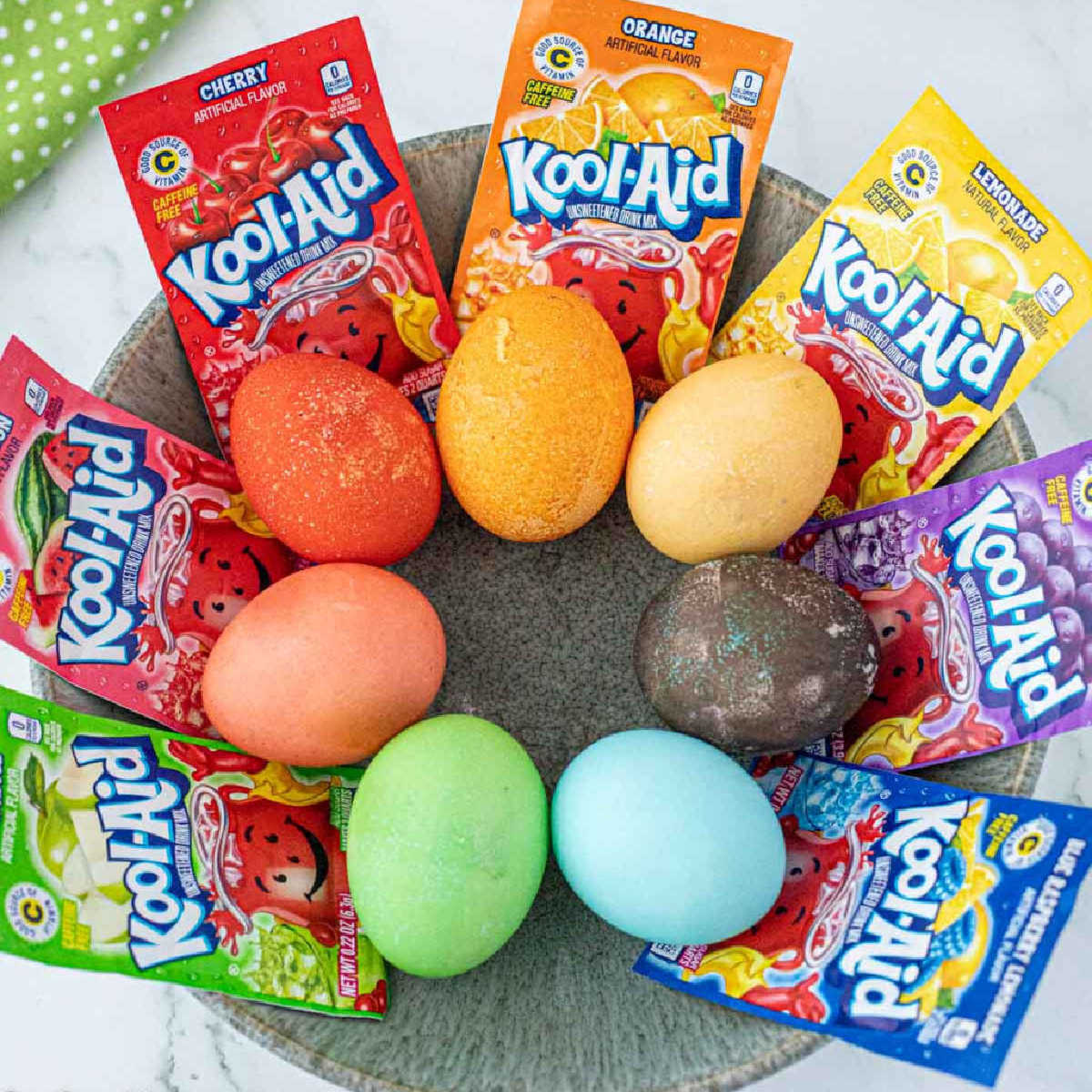 Kool Aid dyed eggs in a basket.