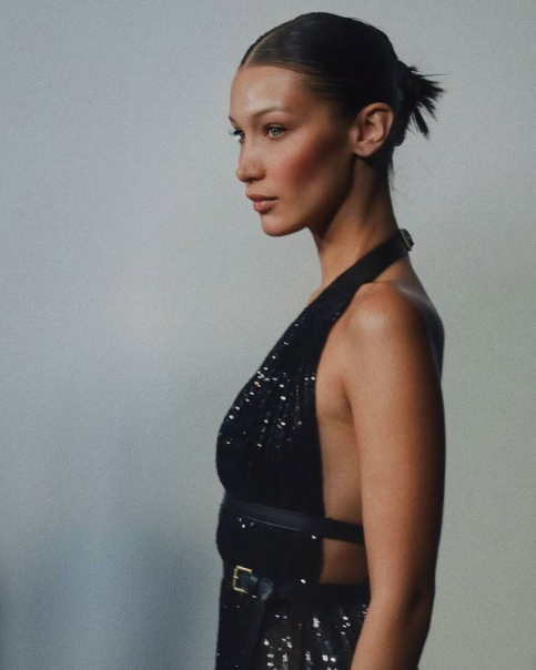 Spiky Bun on lady in black dress.